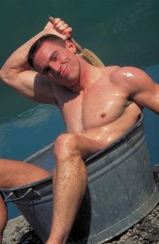 September centerfold at For The Girls - hot guy in an iron bath tub.