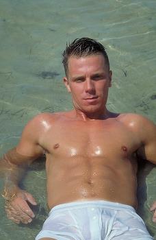 Pic: Sexy Simon reclines at the beach. Nice chest!