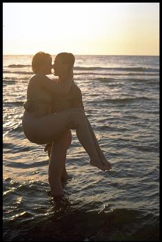 Pic: Romance at the beach for this couple in the nude. More at For The Girls.